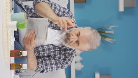 Vertical-video-of-The-forgetful-old-man-is-solving-puzzles.
